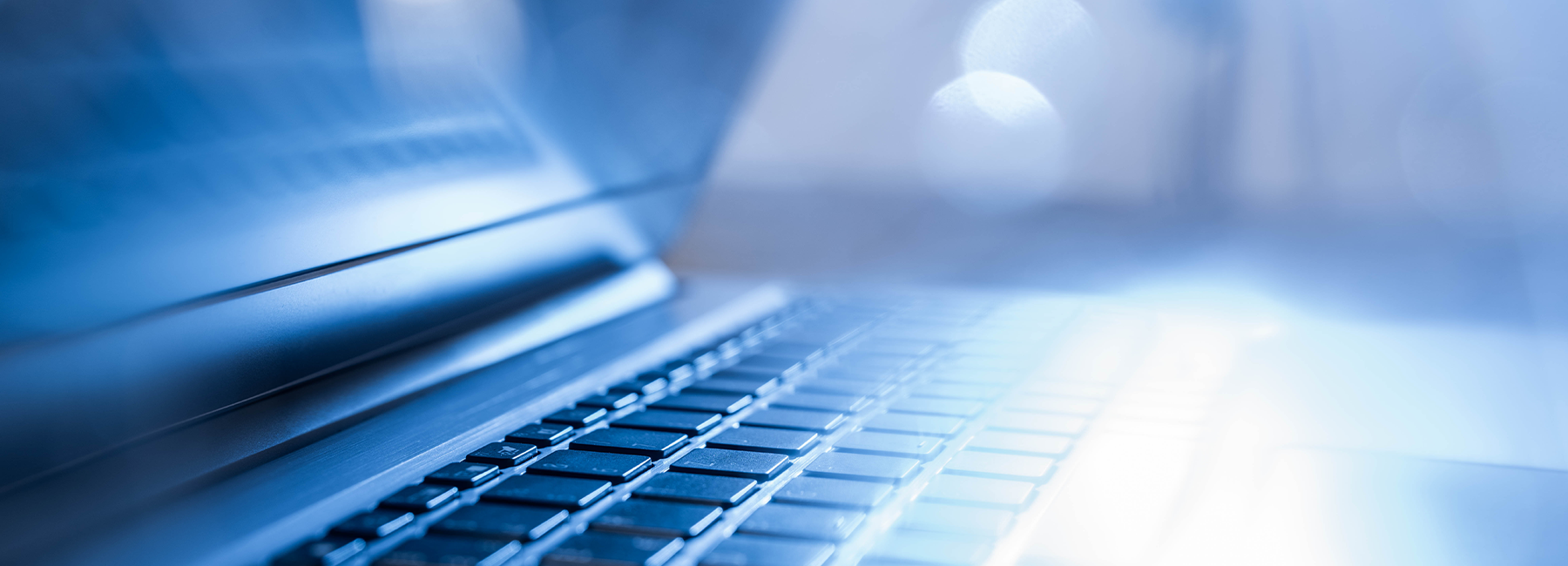 Laptop in an office, Mainframe as a Service | DXC Technology Customer Story